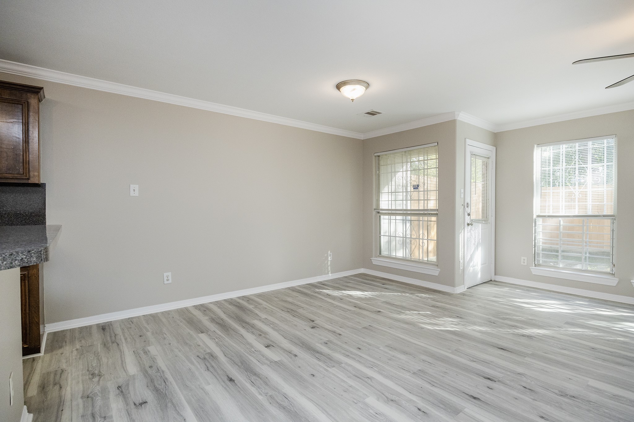 4624 Larkspur Street, Unit B Houston, TX 77051 - Photo 23 of 49 a view of wooden floor and windows in a room