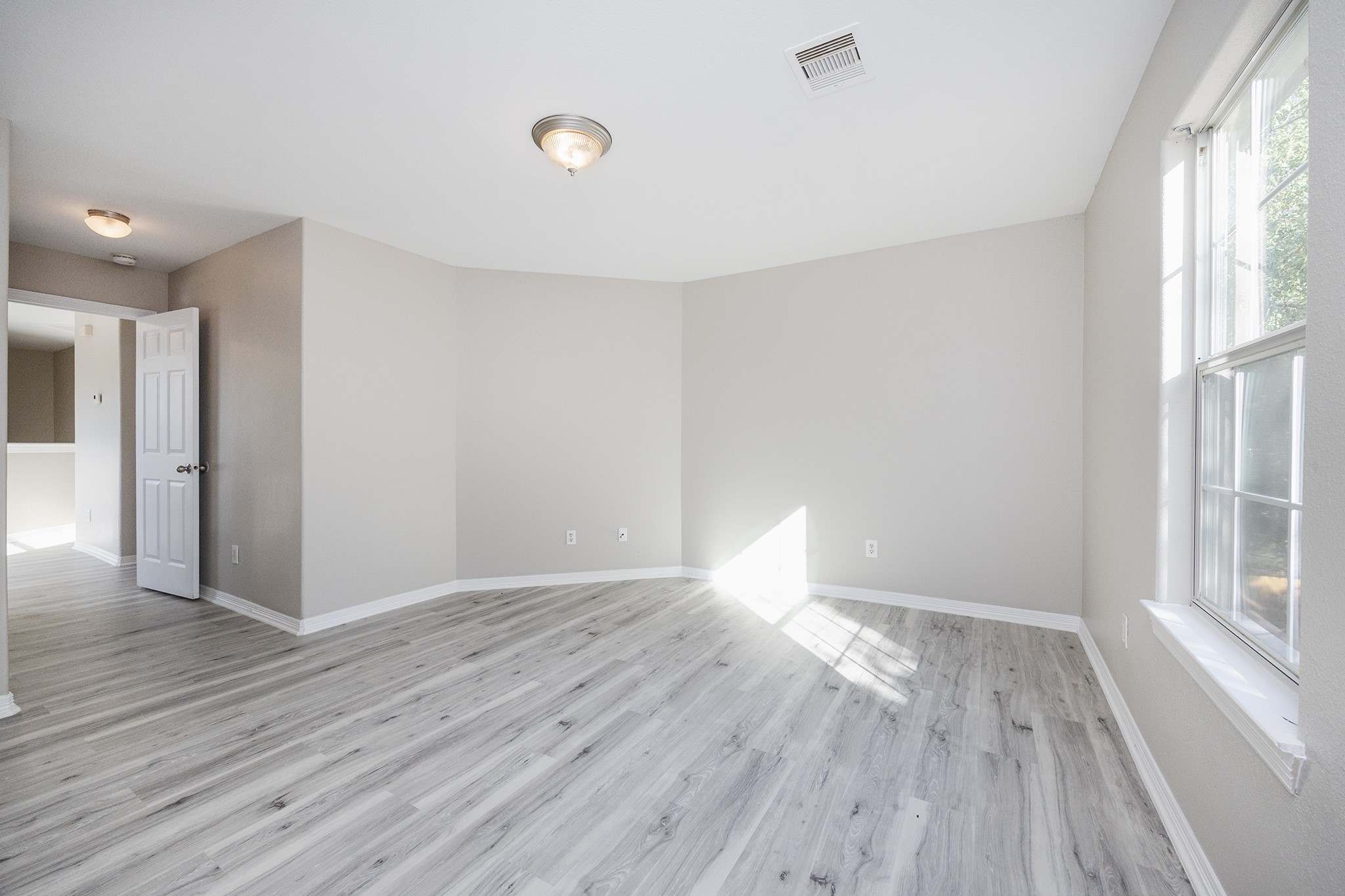 4624 Larkspur Street, Unit B Houston, TX 77051 - Photo 28 of 49 a view of wooden floor and windows in a room