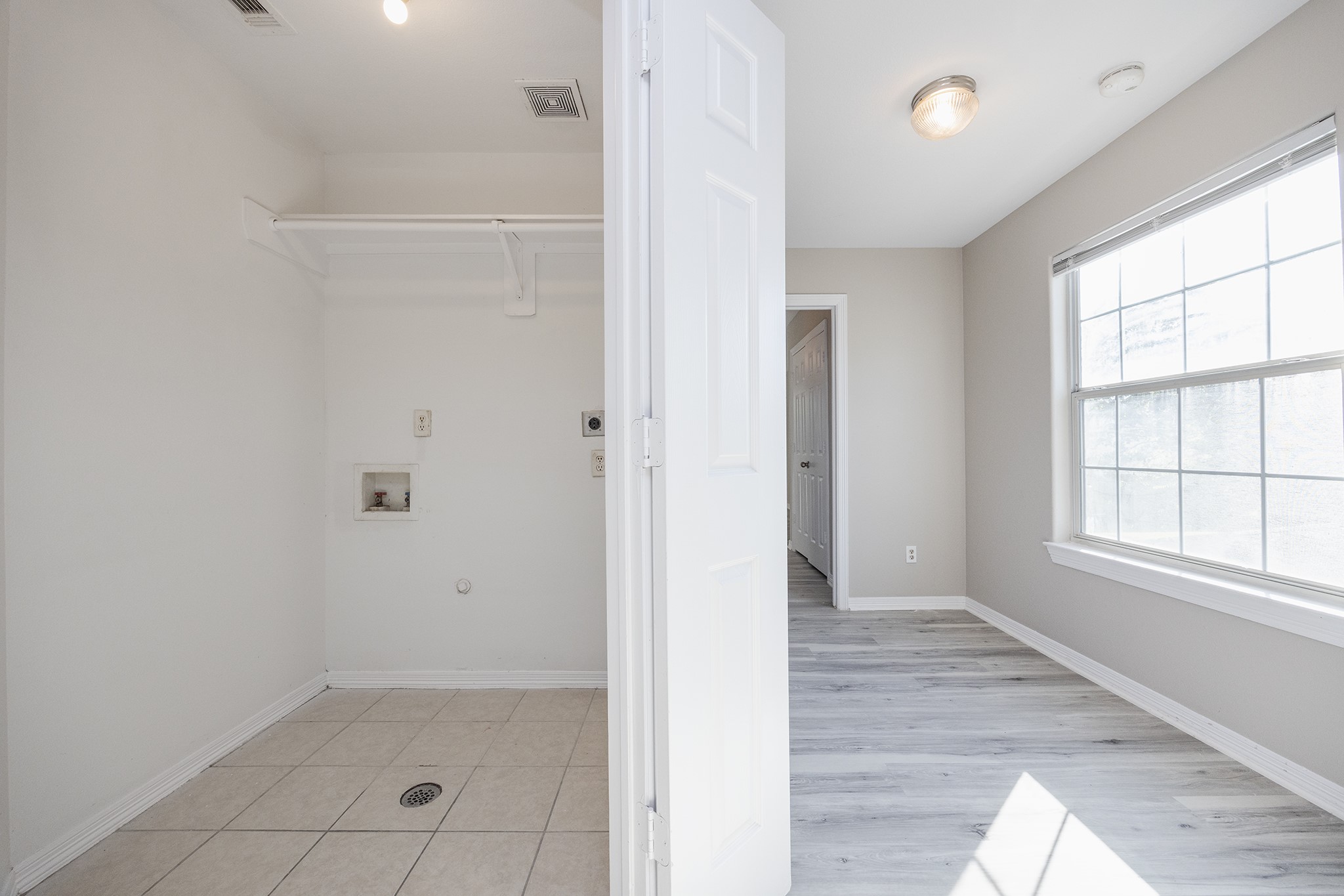 4624 Larkspur Street, Unit B Houston, TX 77051 - Photo 35 of 49 an empty room with wooden floor and windows