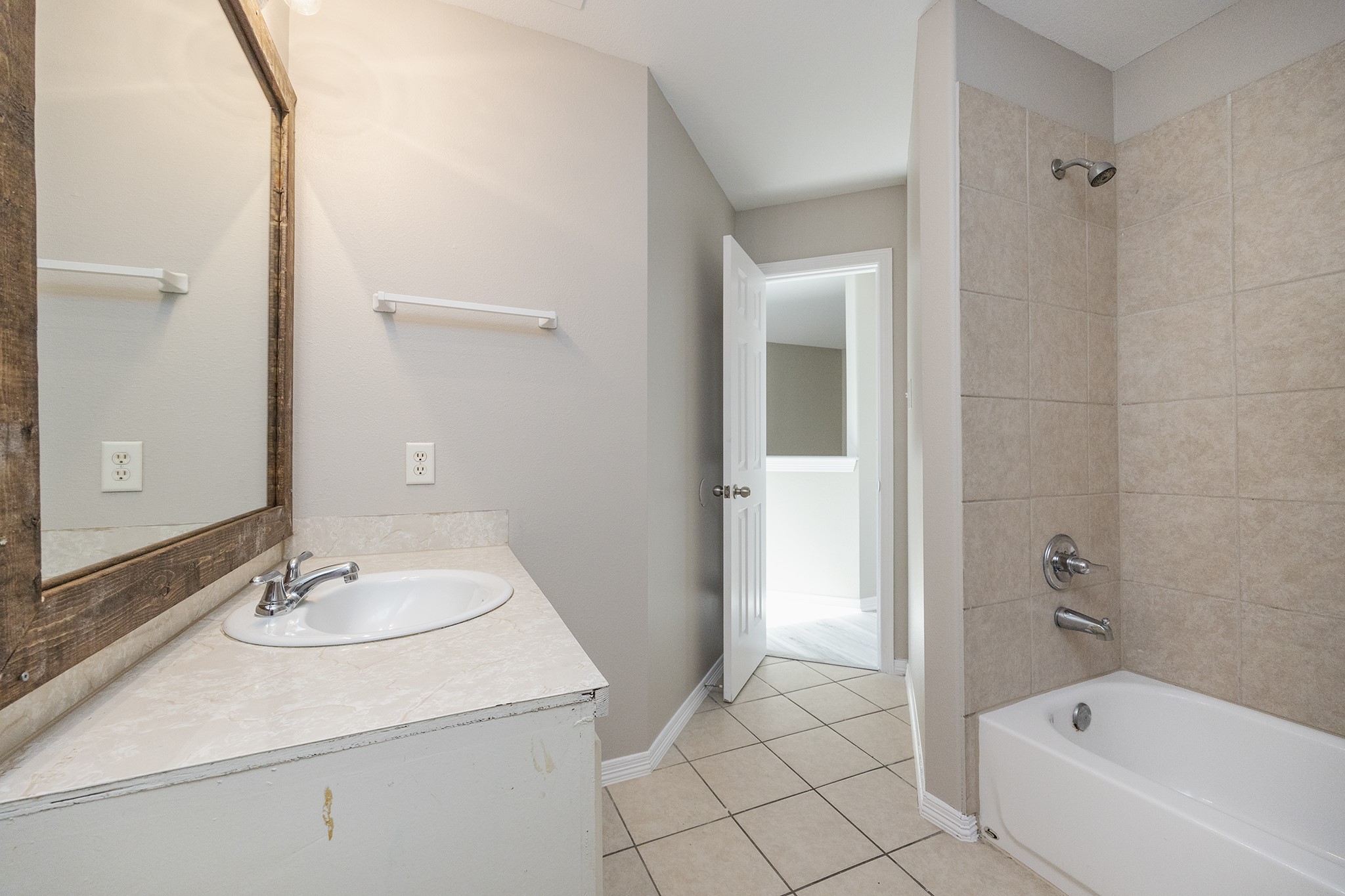 4624 Larkspur Street, Unit B Houston, TX 77051 - Photo 40 of 49 a bathroom with a sink and a mirror