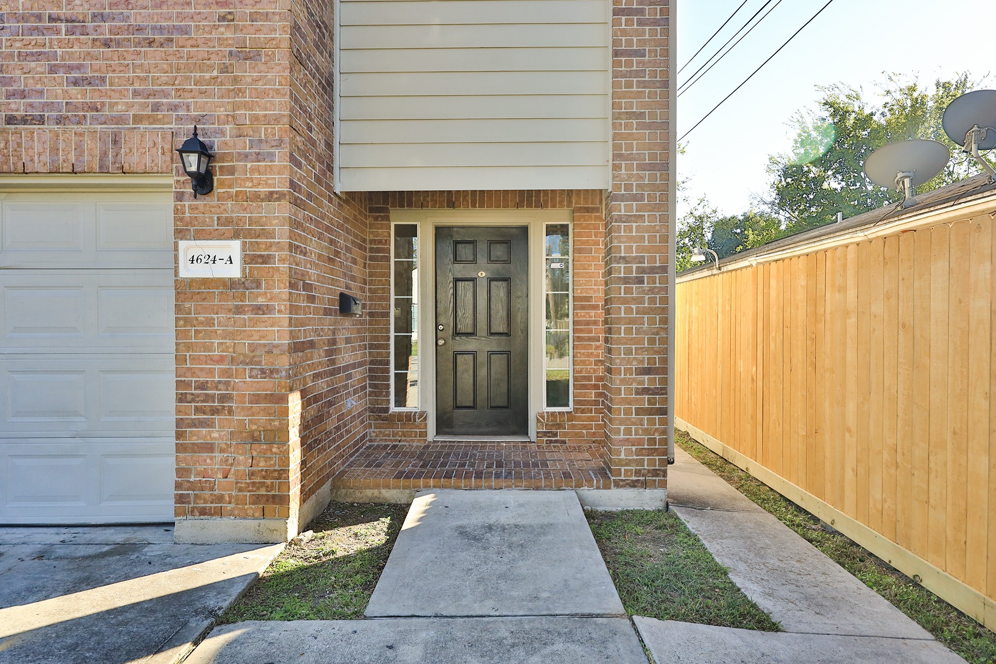 4624 Larkspur Street, Unit B Houston, TX 77051 - Photo 4 of 49 a front view of a house with a garden