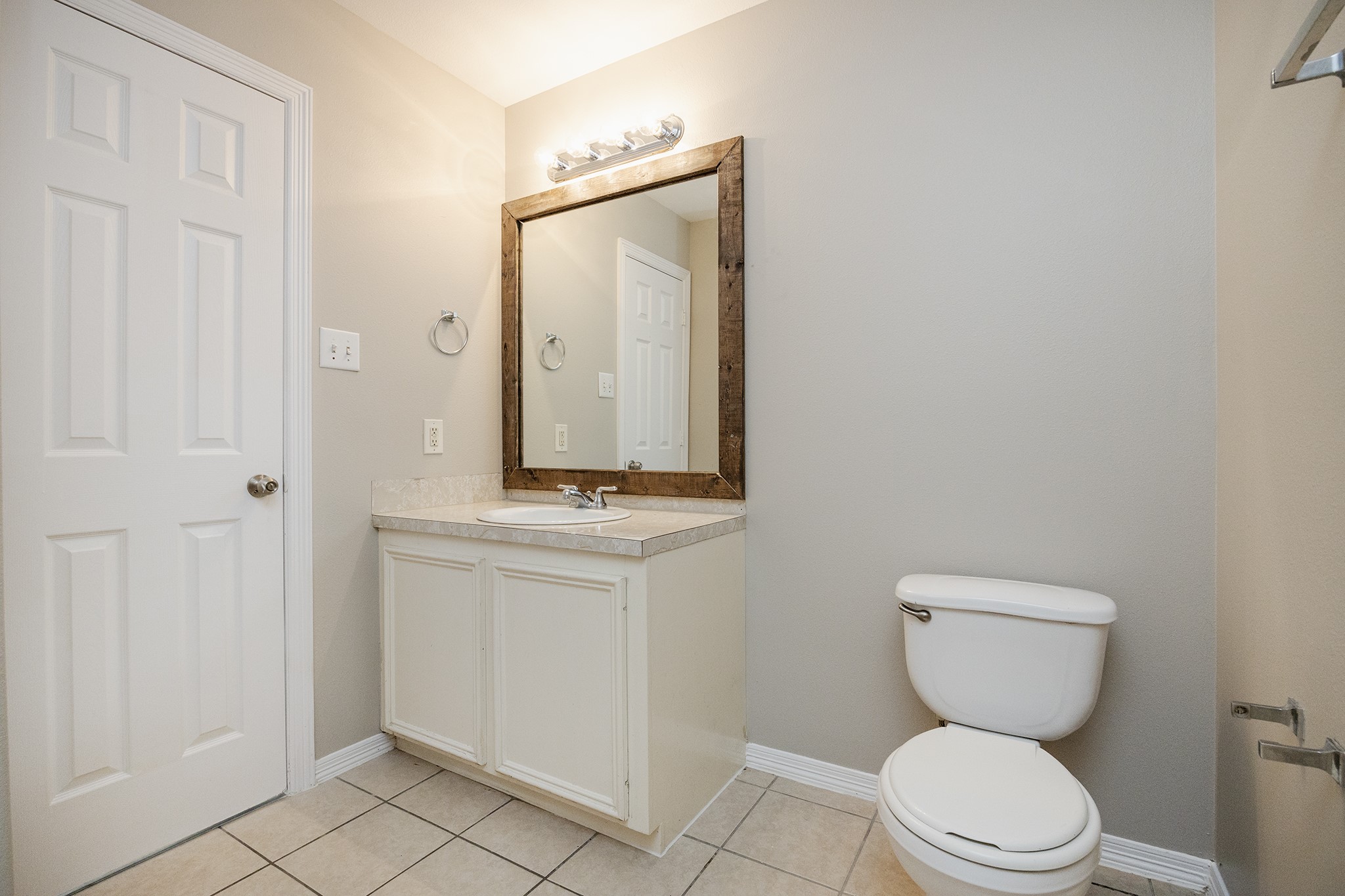 4624 Larkspur Street, Unit B Houston, TX 77051 - Photo 43 of 49 a bathroom with a toilet a sink and a mirror