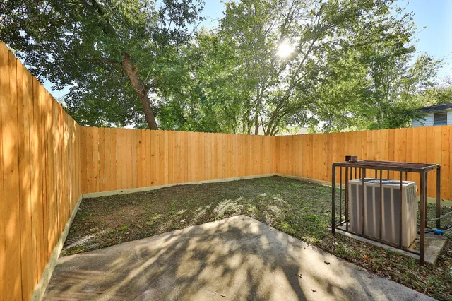 a view of a house with backyard porch and sitting area
