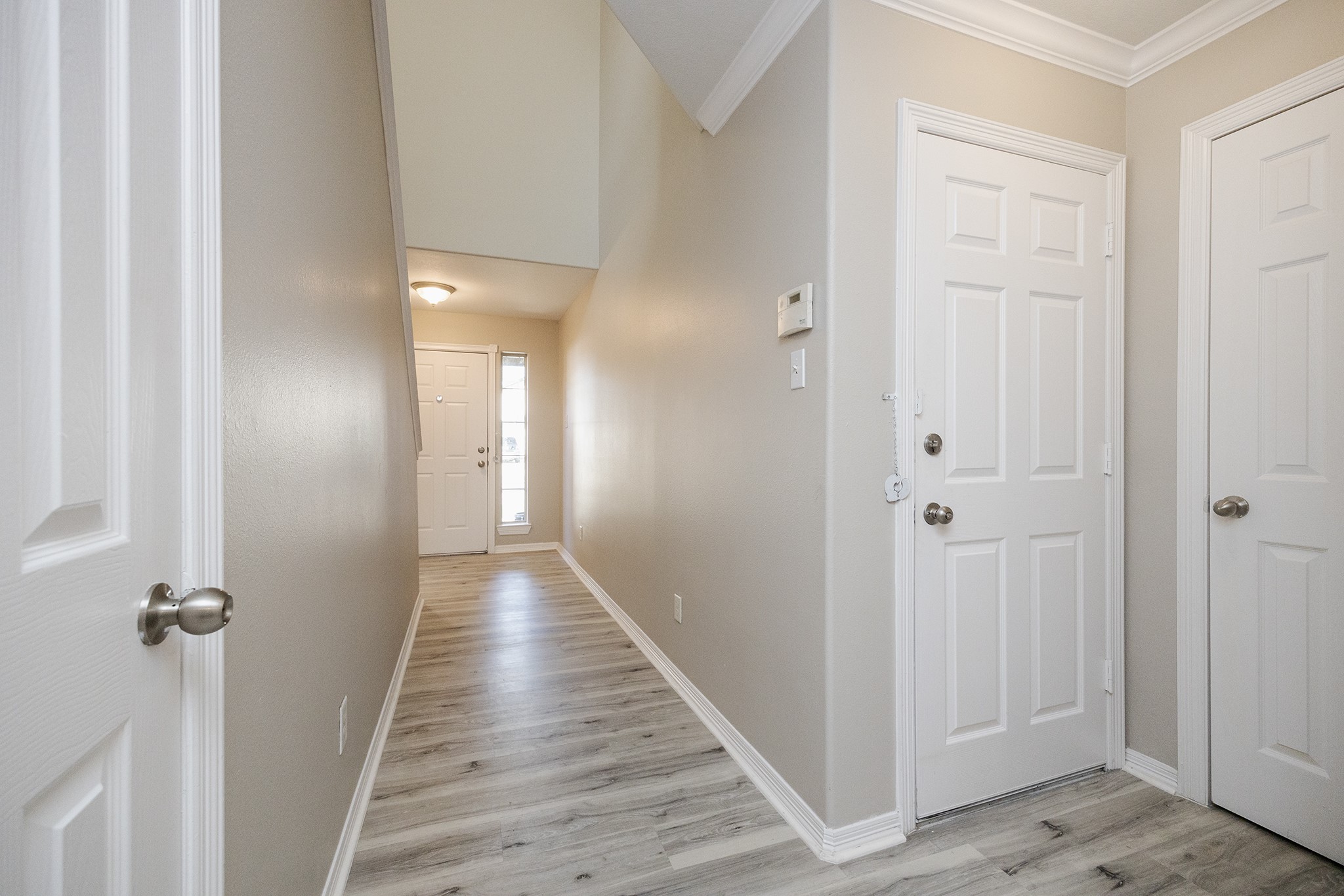 4624 Larkspur Street, Unit B Houston, TX 77051 - Photo 8 of 49 a view of a hallway with wooden floor