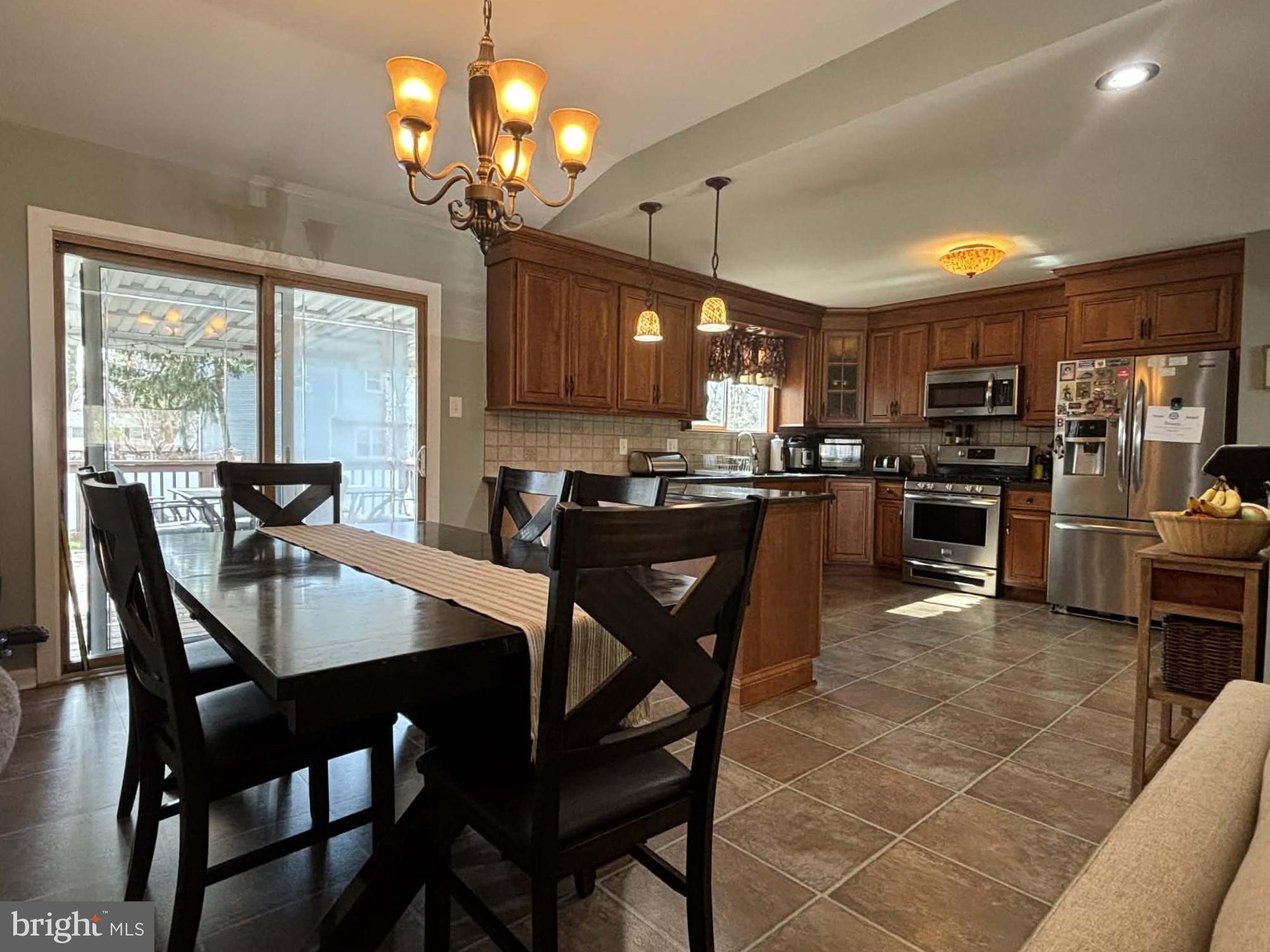 30 Estate Road Lumberton, NJ 08048 - Photo 2 of 40 a kitchen with stainless steel appliances granite countertop table chairs stove a refrigerator and a microwave