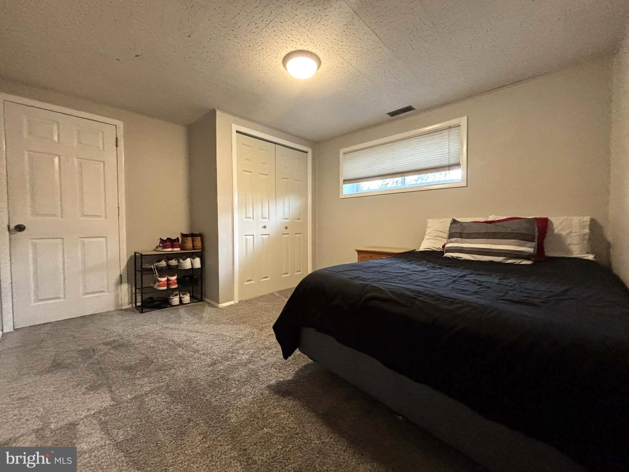 30 Estate Road Lumberton, NJ 08048 - Photo 23 of 40 a bedroom with a bed and a car