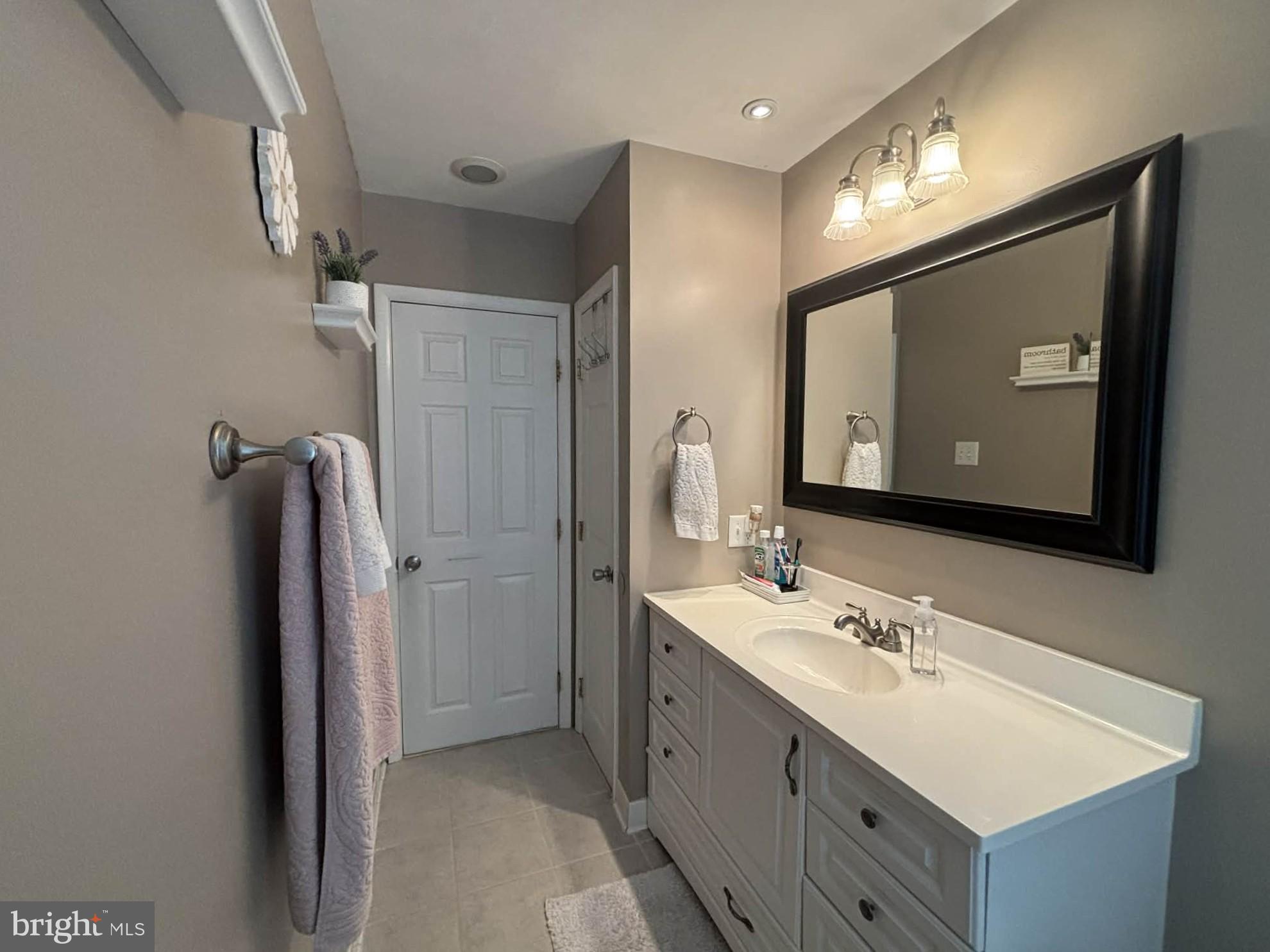 30 Estate Road Lumberton, NJ 08048 - Photo 25 of 40 a bathroom with a double vanity sink and mirror
