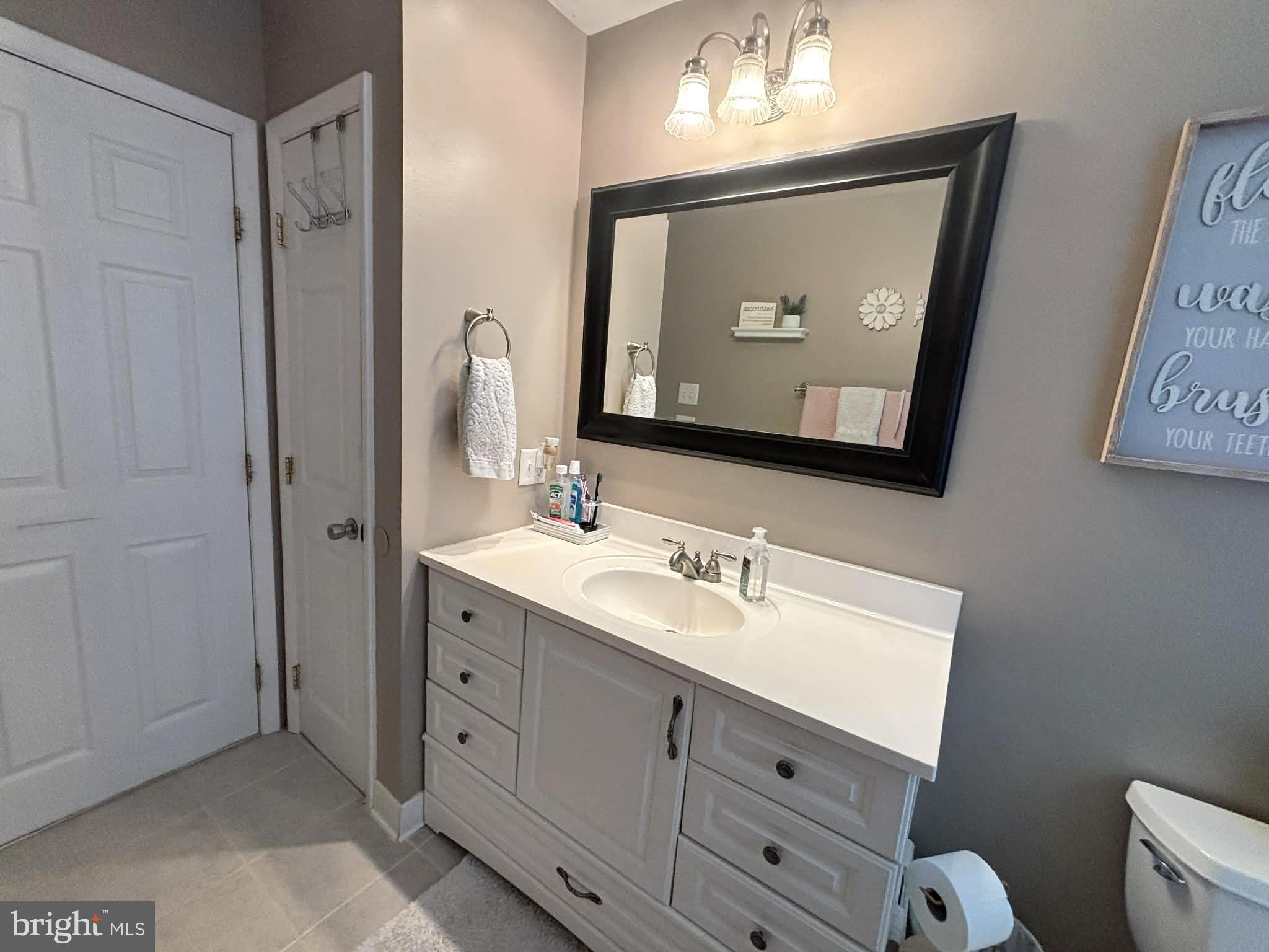 30 Estate Road Lumberton, NJ 08048 - Photo 26 of 40 a bathroom with a double vanity sink and mirror
