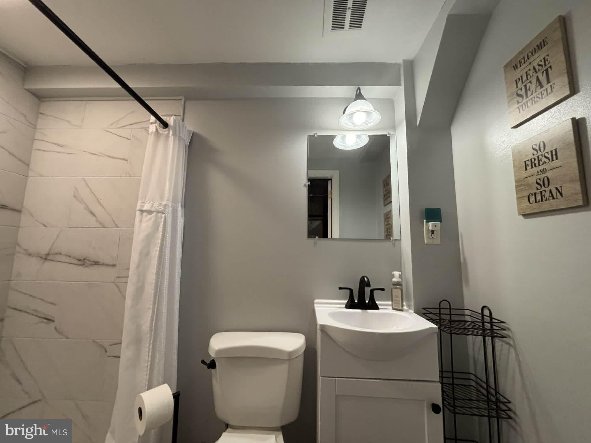 30 Estate Road Lumberton, NJ 08048 - Photo 27 of 40 a bathroom with a toilet sink and mirror