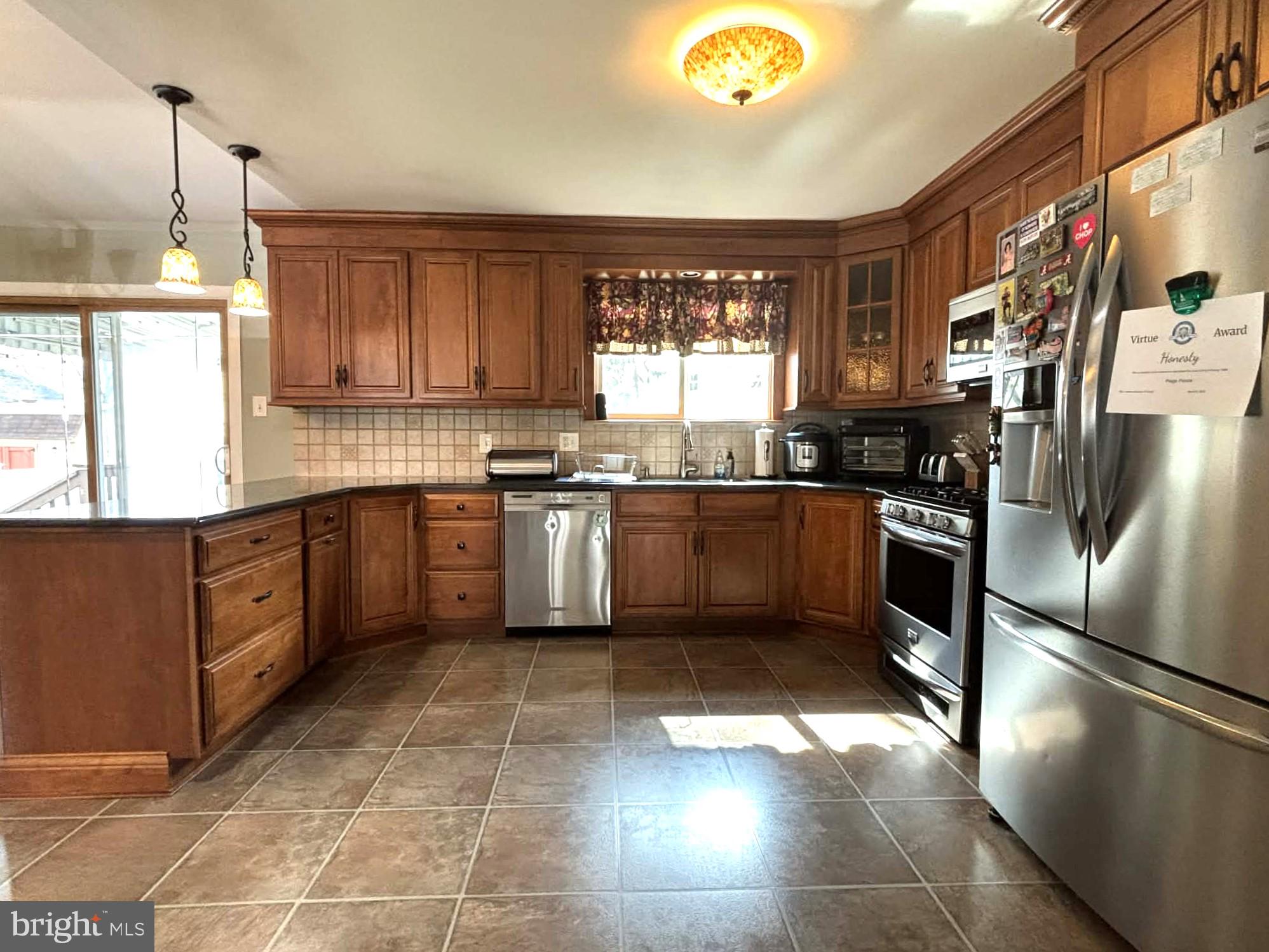 30 Estate Road Lumberton, NJ 08048 - Photo 5 of 40 a kitchen with stainless steel appliances granite countertop a sink a stove a refrigerator cabinets and a window