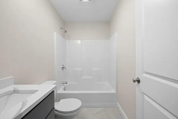 a bathroom with a sink a toilet and a bathtub