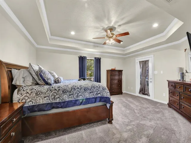 a kitchen with stainless steel appliances granite countertop a refrigerator a stove and a sink with wooden floor