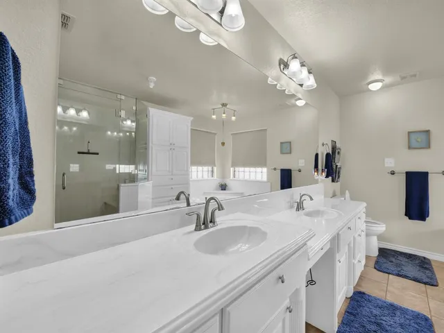 an aerial view of a town with swimming pool and outdoor seating