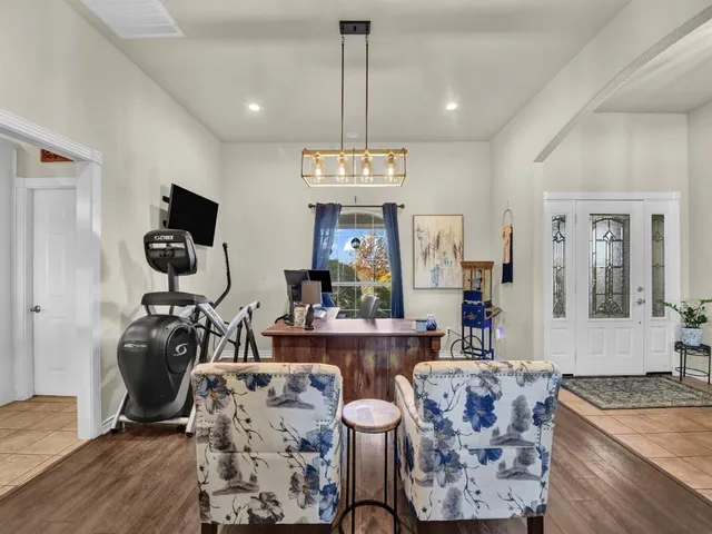 a living room with fireplace furniture and a flat screen tv