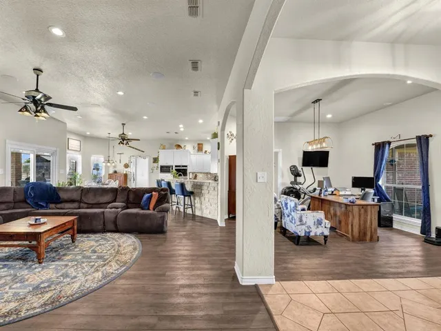 a view of a dining room and a table chairs
