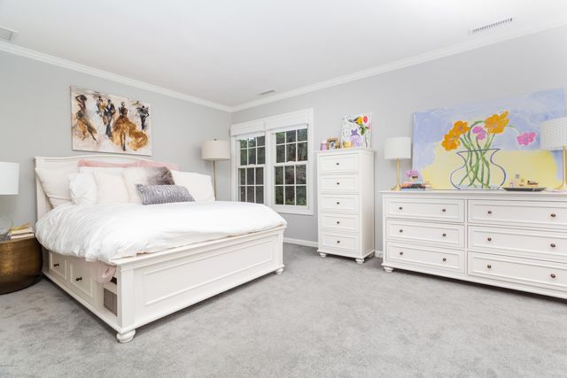 a bed room with a bed and a window