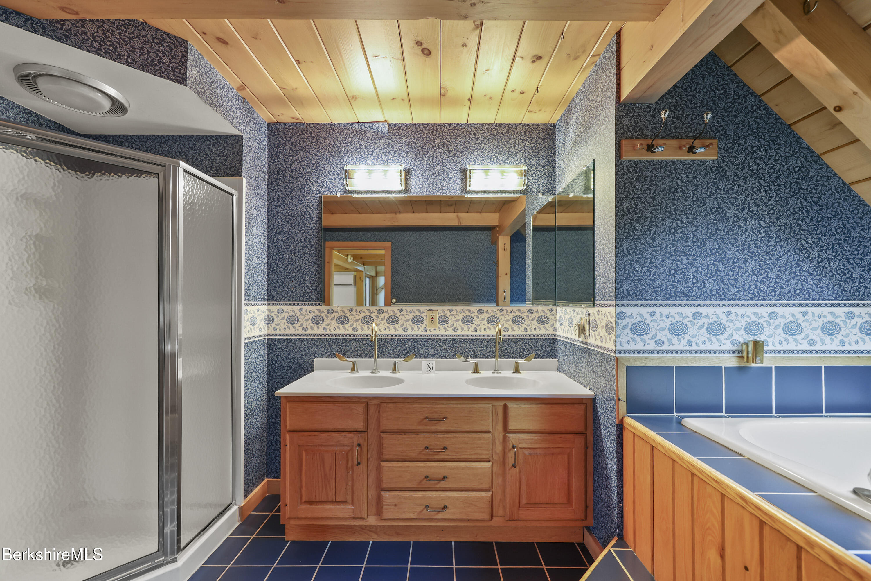 1030 Simonds Road Williamstown, MA 01267 - Photo 35 of 76 a bathroom with a sink a mirror and a shower