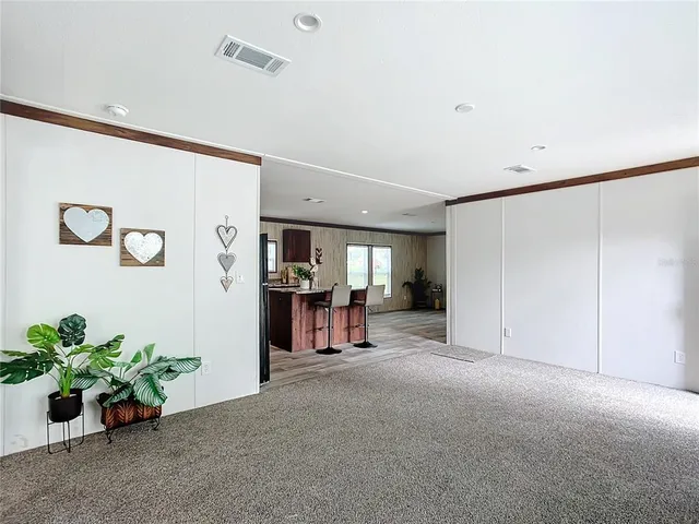 a view of livingroom with hardwood and hallway