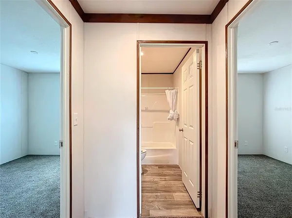 a view of a bathroom from the hallway