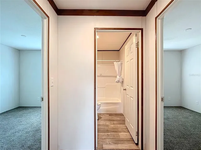 a view of a bathroom from the hallway