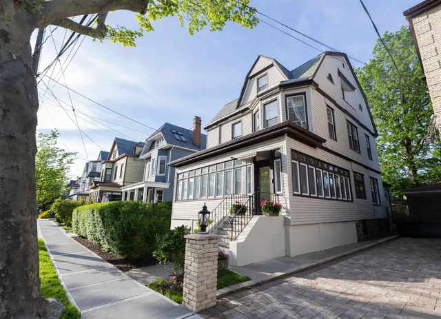 a view of a house with a street