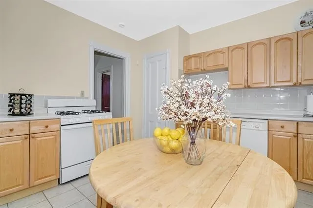 a kitchen with appliances and cabinets