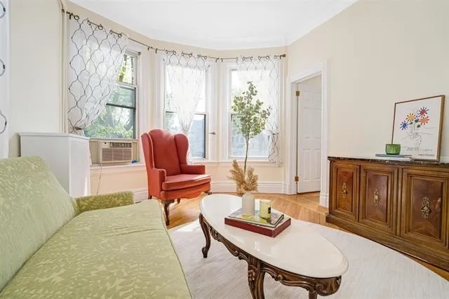 a living room with furniture and a window