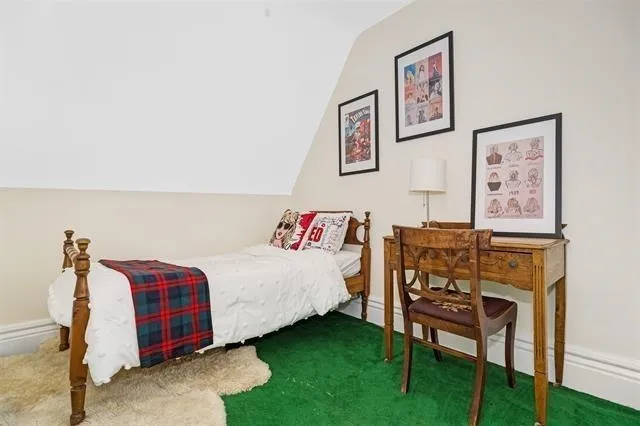 a bedroom with a bed and a cabinets