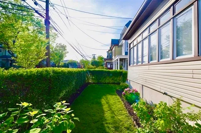a view of a house with a backyard