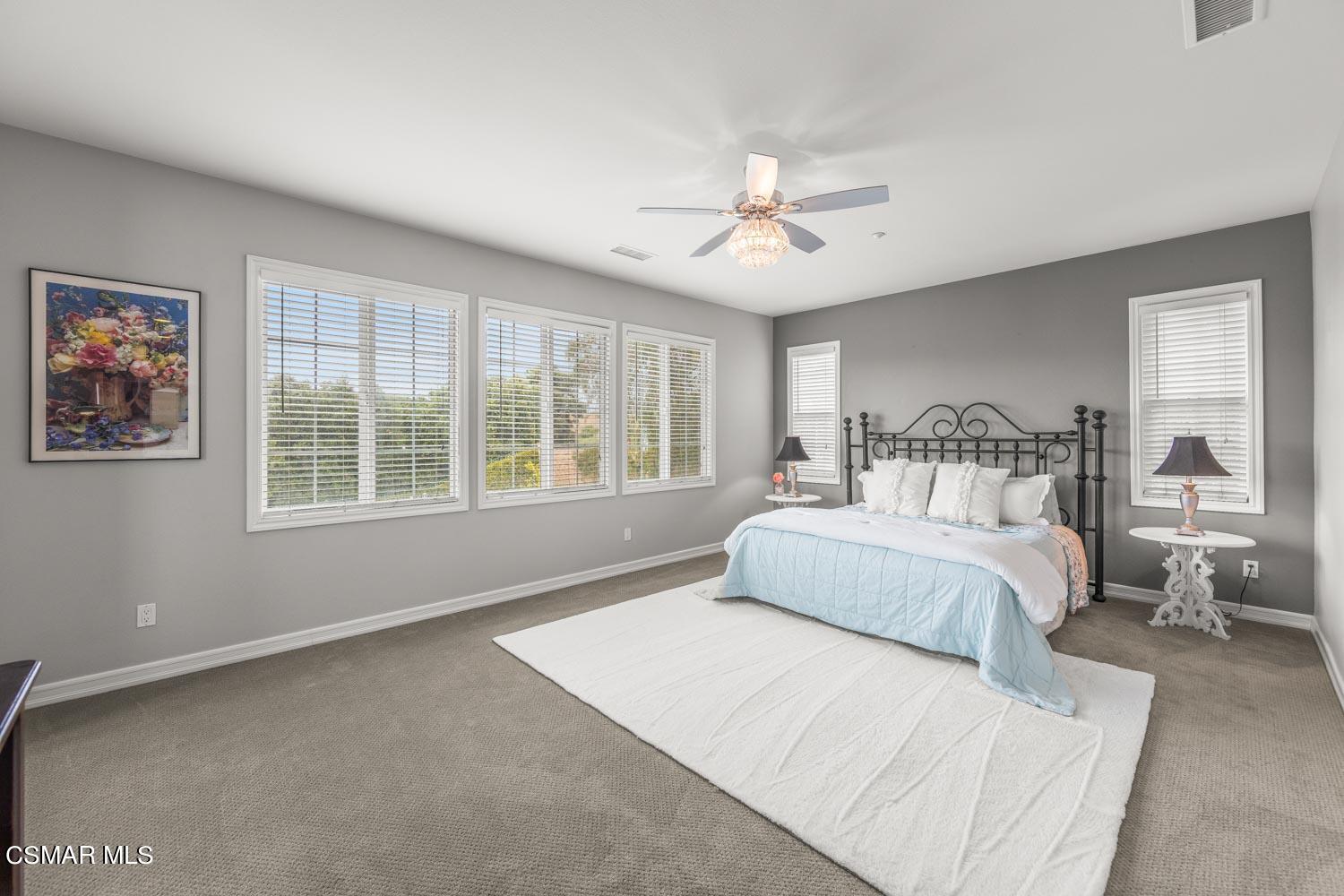 413 Vineyard Drive Simi Valley, CA 93065 - Photo 13 of 26 a bedroom with a large bed and a window