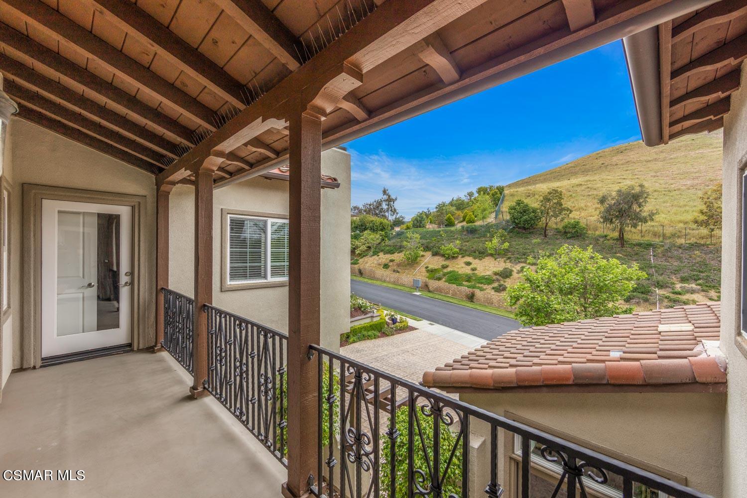 413 Vineyard Drive Simi Valley, CA 93065 - Photo 17 of 26 a view of a balcony with chair and wooden floor