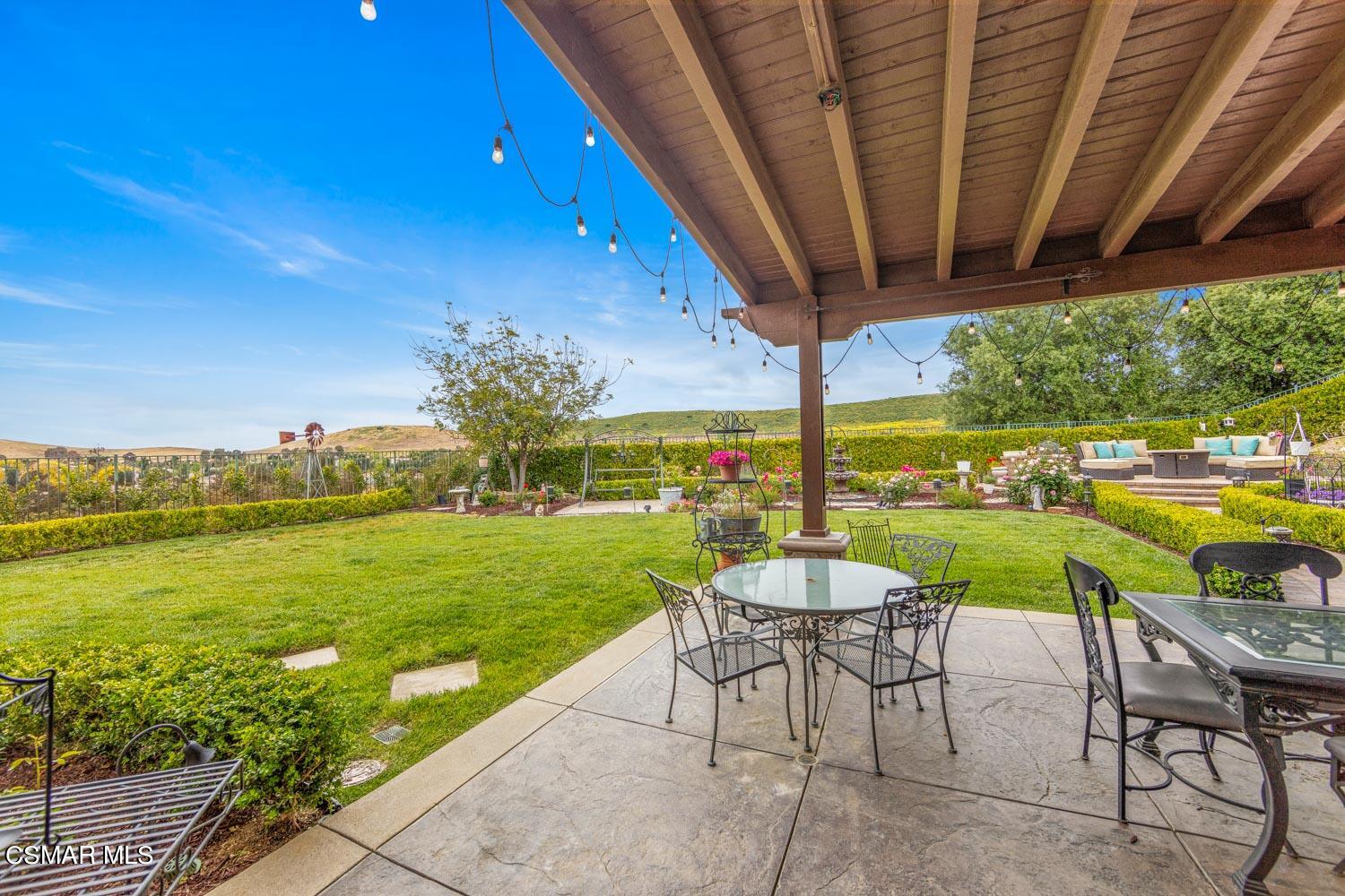 413 Vineyard Drive Simi Valley, CA 93065 - Photo 18 of 26 a view of a swimming pool and chairs in patio
