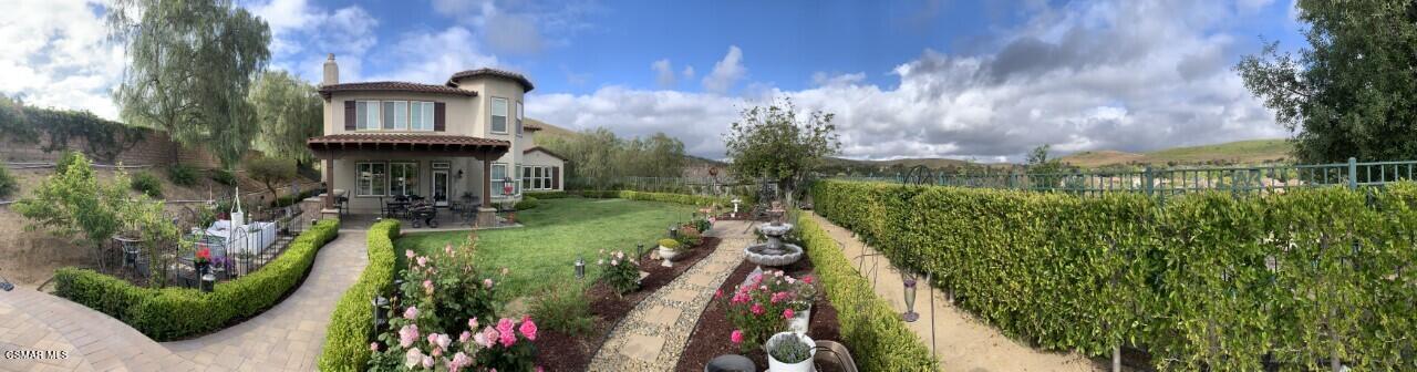 413 Vineyard Drive Simi Valley, CA 93065 - Photo 23 of 26 a view of a house with a yard and potted plants