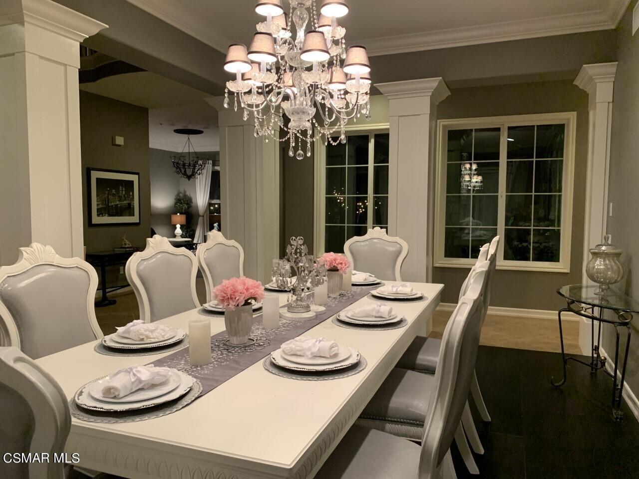 413 Vineyard Drive Simi Valley, CA 93065 - Photo 4 of 26 a dining room with furniture a large window and wooden floor