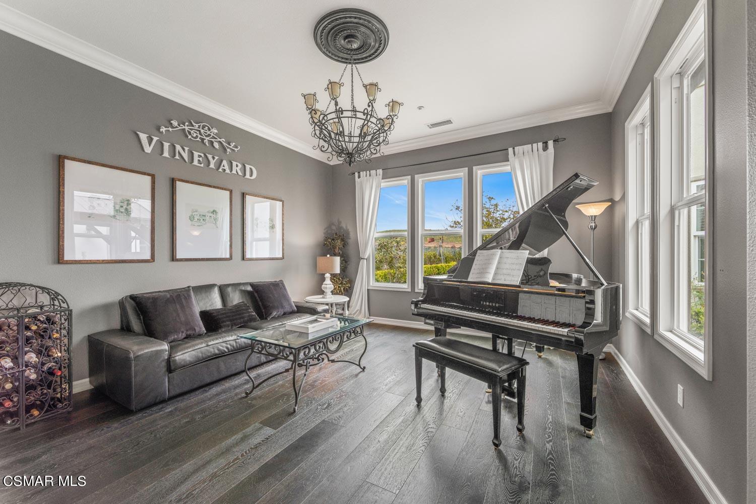 413 Vineyard Drive Simi Valley, CA 93065 - Photo 5 of 26 a living room with furniture and a wooden floor