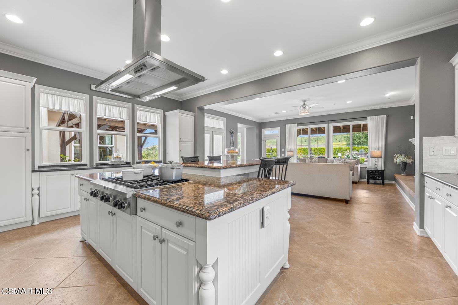 413 Vineyard Drive Simi Valley, CA 93065 - Photo 7 of 26 a kitchen with stainless steel appliances granite countertop a stove and a sink