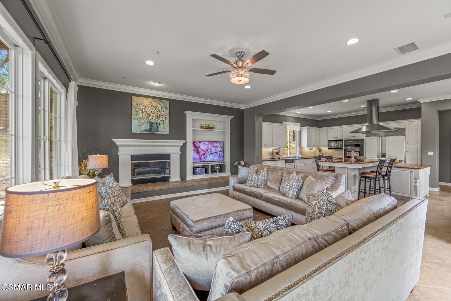 413 Vineyard Drive Simi Valley, CA 93065 - Photo 9 of 26 a living room with furniture and a fireplace