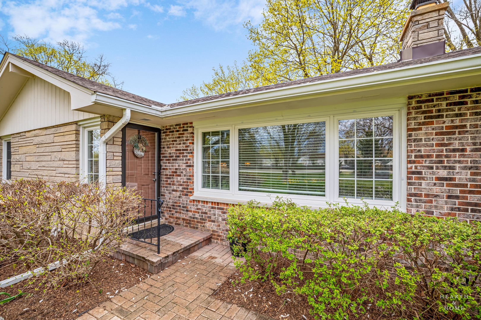 1015 Highway 22 Fox River Grove, IL 60021 - Photo 5 of 46 a front view of a house with a large windows and plants