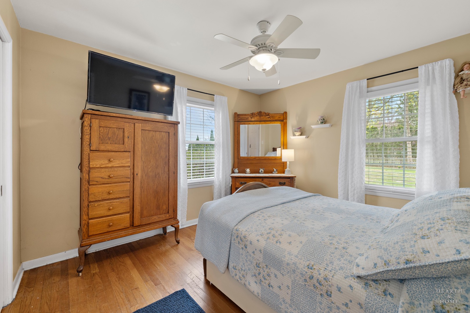 1015 Highway 22 Fox River Grove, IL 60021 - Photo 9 of 46 a bedroom with a bed and a flat tv screen on dresser