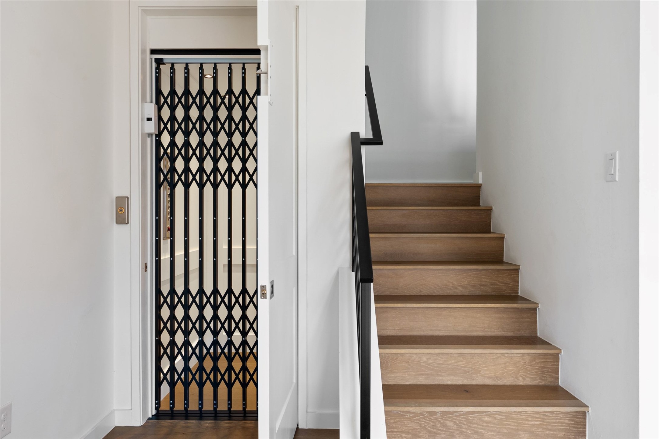 700 Ariana Court Austin, TX 78746 - Photo 12 of 39 Elevator/lower level stairs