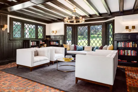 a bedroom with furniture and white walls