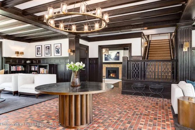 a bedroom with a bed couch and a window