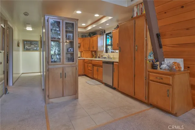 a bathroom with a glass door shower a sink and a mirror