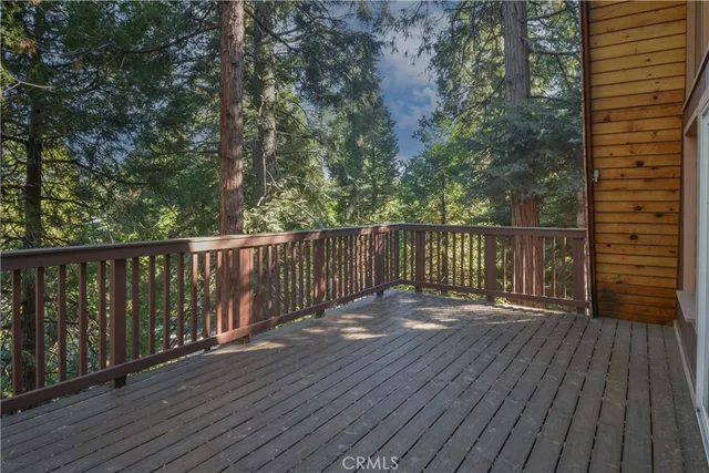 a view of wooden deck and a garden