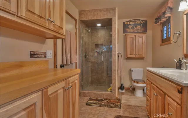 a bed room with a bed and a chandelier