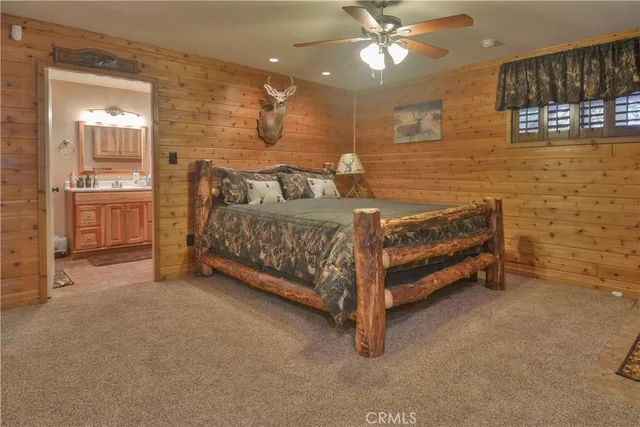 a bedroom with a bed dresser and a window