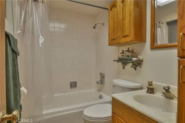 a bathroom with a sink a toilet and bathtub