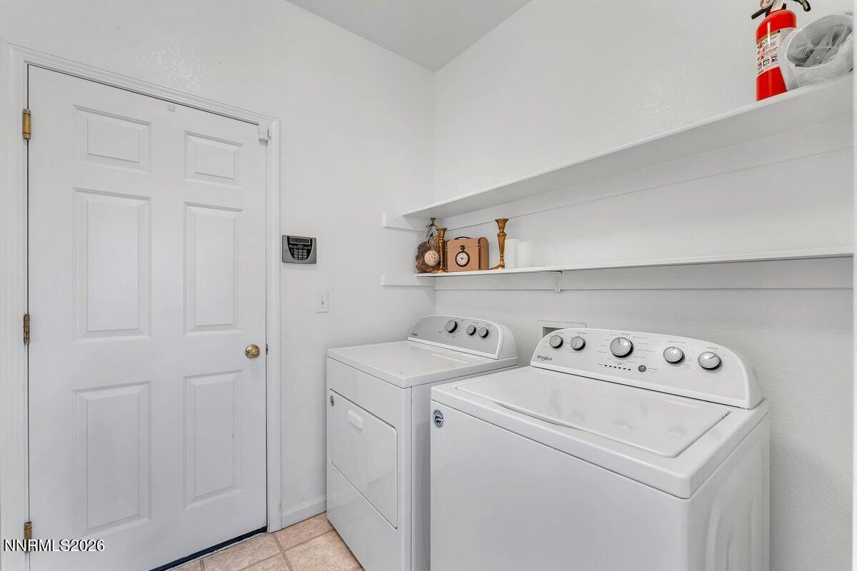 9765 Rock River Drive Reno, NV 89506 - Photo 19 of 25 a utility room with dryer and washer