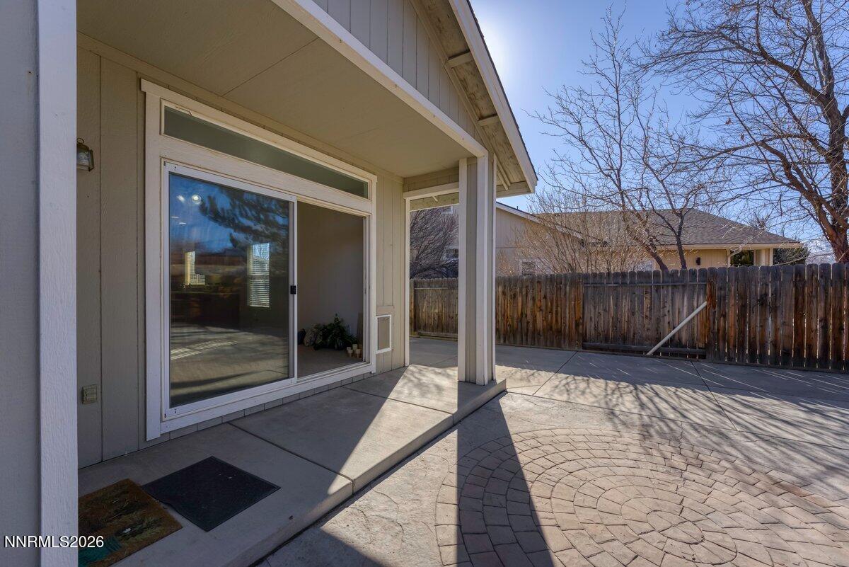 9765 Rock River Drive Reno, NV 89506 - Photo 21 of 25 a view of a glass door with a yard