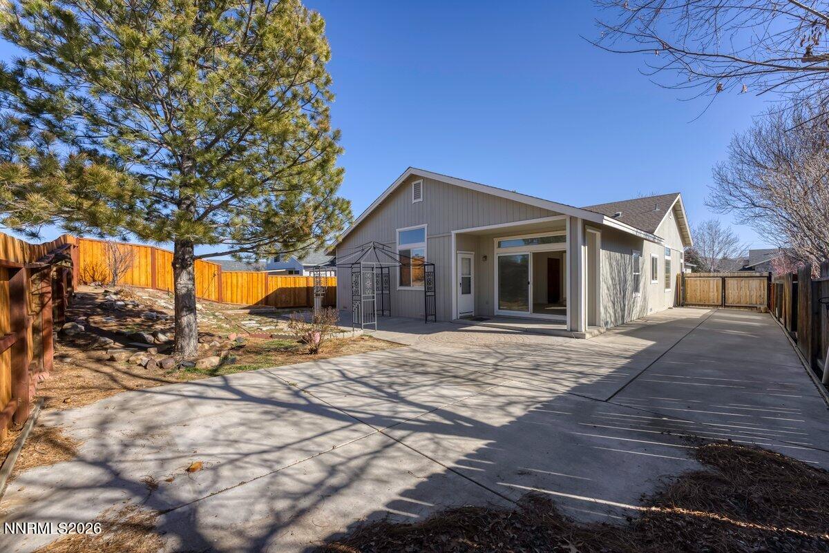 9765 Rock River Drive Reno, NV 89506 - Photo 23 of 25 a front view of a house with a yard